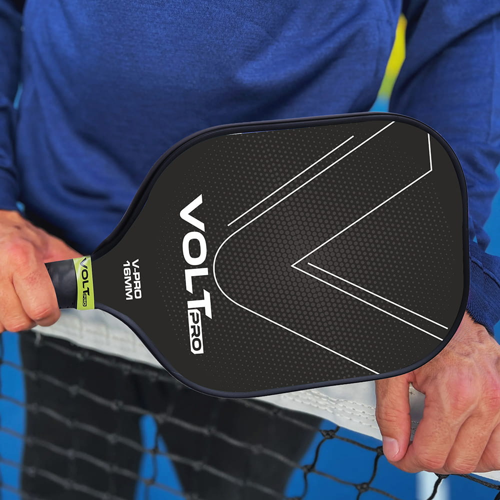 Volt Pro Pickleball Paddle Set includes 2 carbon fiber paddles, 2 pickleball balls, and 1 cover bag. With a 16mm polymer core and gritty spin surface, the paddles offer a balanced combination of control, spin, and comfortable handling for indoor and outdoor play.