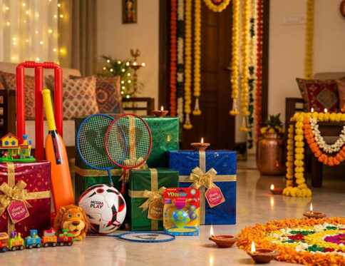 Child bouncing a glowing LED ball on Diwali night"; "Kids chasing bubbles from an automatic bubble gun on a terrace"; "Family playing badminton in a festive courtyard"; "Wrapped Diwali gifts with toys for kids".